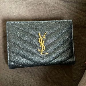 BI-FOLD ZIPPED YSL wallet in black and gold metal